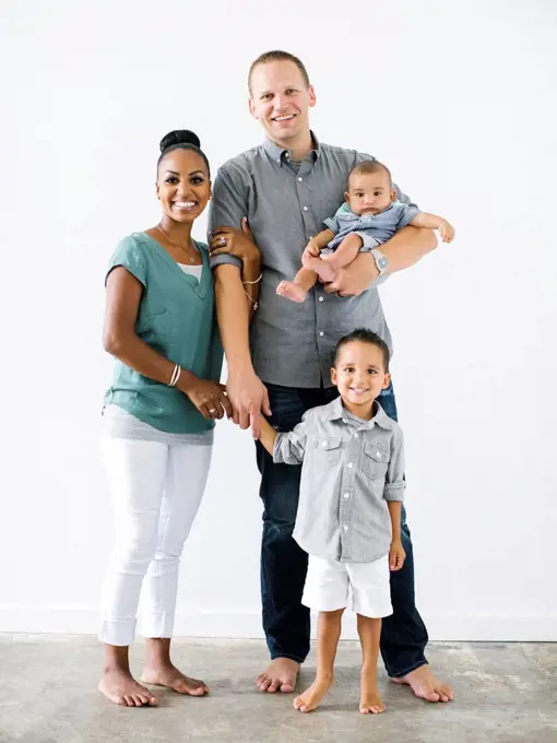 Portrait of family with two children (2-5 months, 2-3)