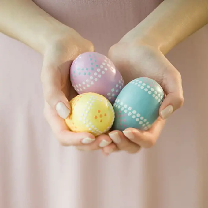 Woman holding decorated eggs