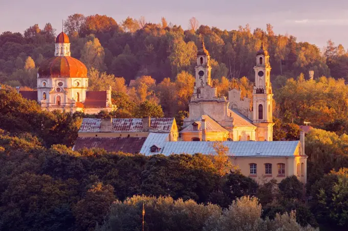 Lithuania, Vilnius, morning view of churches among trees