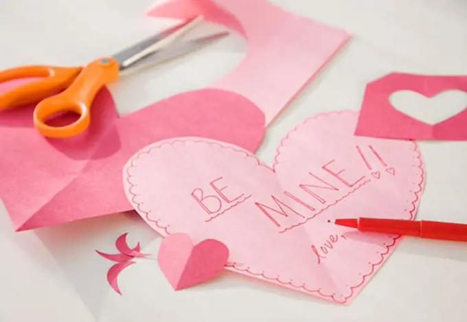 Home-made valentine next to scissors