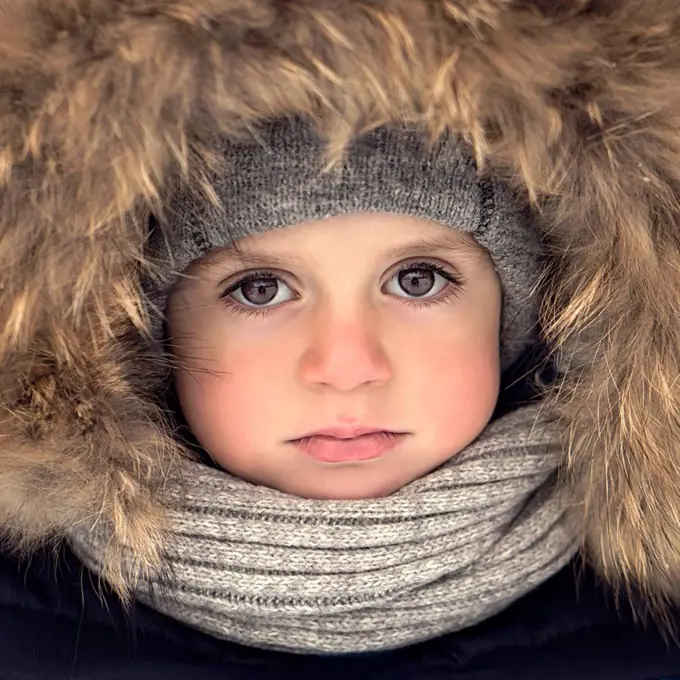 Boy with fur hood and scarf