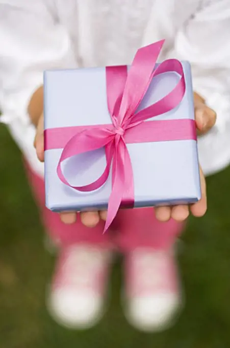 Closeup of a present in a childs hands
