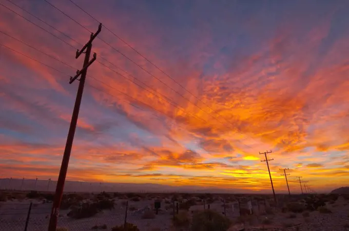 USA, California, Palm Springs, power line at sunrise