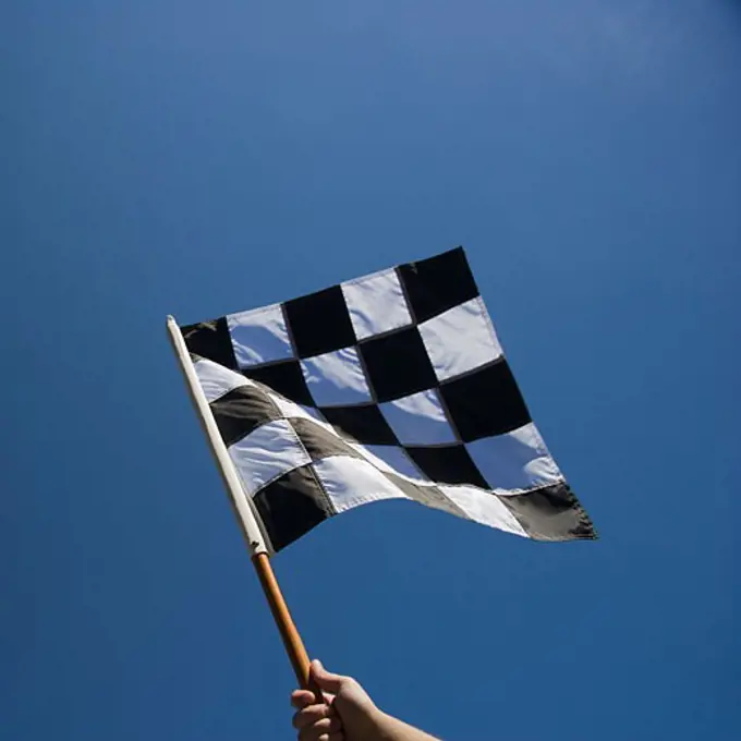 Checkered flag with blue sky
