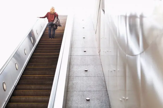 USA, California, Los Angeles, Woman on escalator in subway station