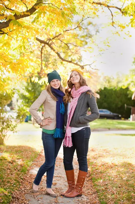 Portrait of two young women in autumn day