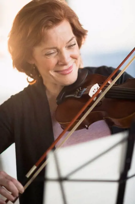 Senior woman playing violin