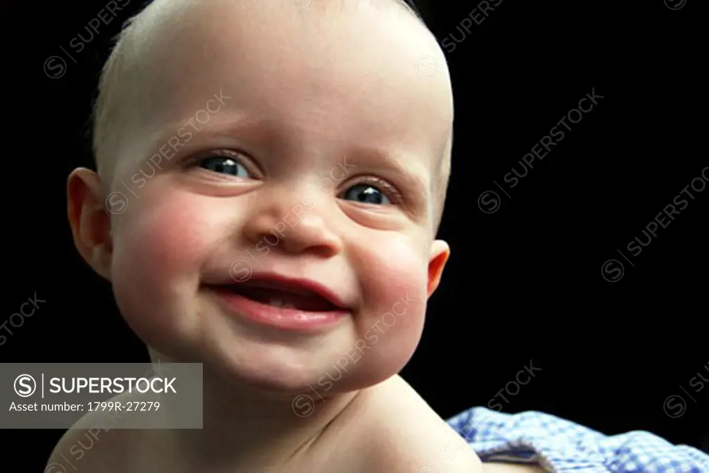 Close-up of a baby girl smiling