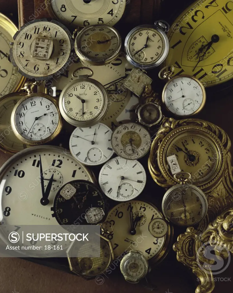 Close-up of antique pocket watches and clocks
