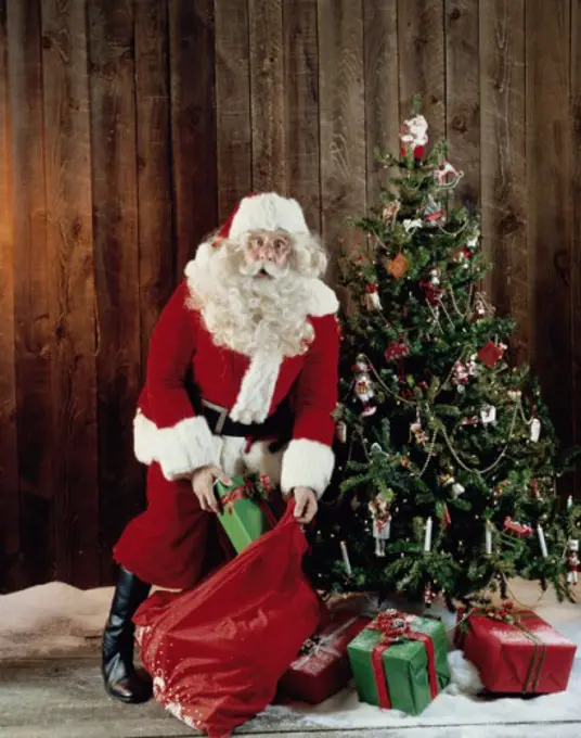 Santa Claus holding a bag of presents