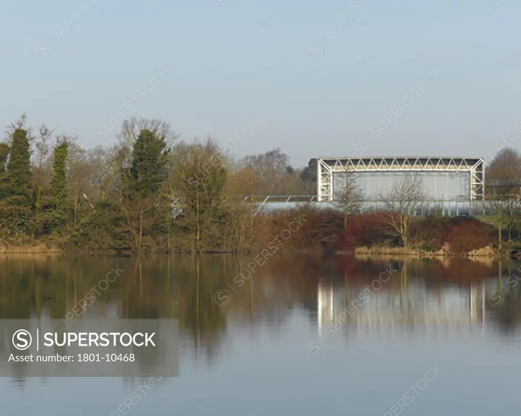 SAINSBURYS CENTRE FOR VISUAL ARTS, UNIVERSITY OF EAST ANGLIA, NORWICH, NORFOLK, UNITED KINGDOM, EXTERIOR VIEW OVER LAKE, FOSTER AND PARTNERS