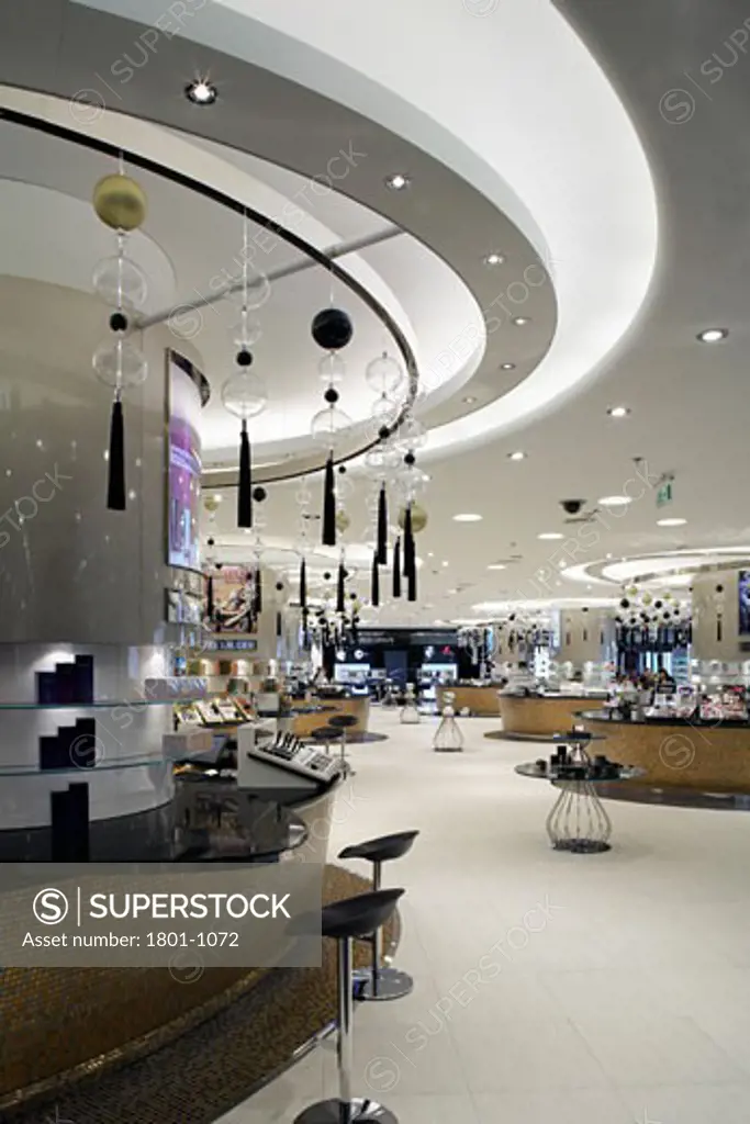 HARVEY NICHOLS DEPARTMENT STORE, KANYON SHOPPING MALL, ISTANBUL, TURKEY, INTERIOR OF THE MAKEUP AND COSMETICS AREA ON THE LOWER GROUND FLOOR, WITH CURVED DISPLAY WALL ON LEFTHAND SIDE., FOUR IV DESIGN