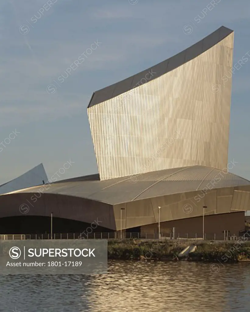 IMPERIAL WAR MUSEUM NORTH, SALFORD, MANCHESTER, UNITED KINGDOM, VIEW ACROSS WATER IN SUNSHINE, DANIEL LIBESKIND