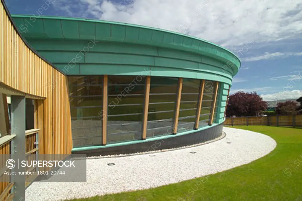 MAGGIES CENTRE, RAIGMORE HOSPITAL, INVERNESS, UNITED KINGDOM, EXTERIOR WITH PICTURE WINDOWS, PAGE AND PARK