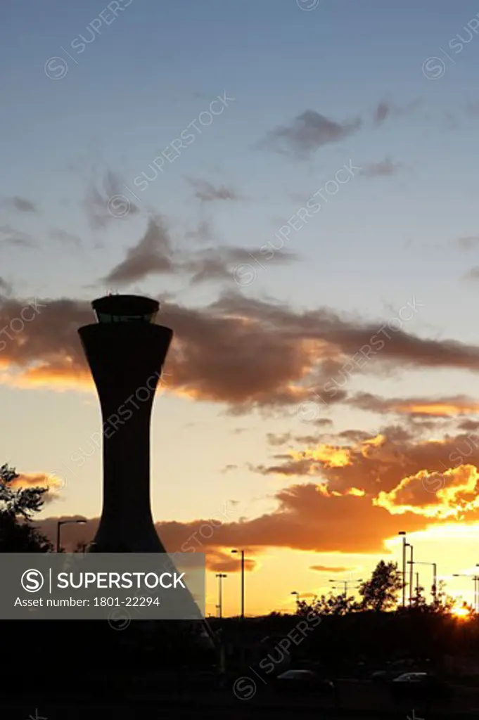 AIR TRAFFIC CONTROL TOWER, EDINBURGH AIRPORT, EDINBURGH, MID LOATHIAN, UNITED KINGDOM, SILLOUETTE OF TOWER WITH ORANGE SUNSET, REID ARCHITECTURE