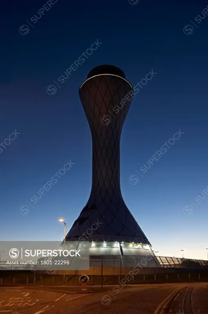 AIR TRAFFIC CONTROL TOWER, EDINBURGH AIRPORT, EDINBURGH, MID LOATHIAN, UNITED KINGDOM, DAWN VIEW LIT FROM APPROACH ROAD, REID ARCHITECTURE