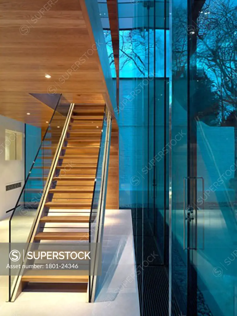 PRIVATE HOUSE EXTENSION, LONDON, UNITED KINGDOM, INSIDE OF STAIRS TO OUTSIDE AT DUSK, SIMON CONDER ASSOCIATES