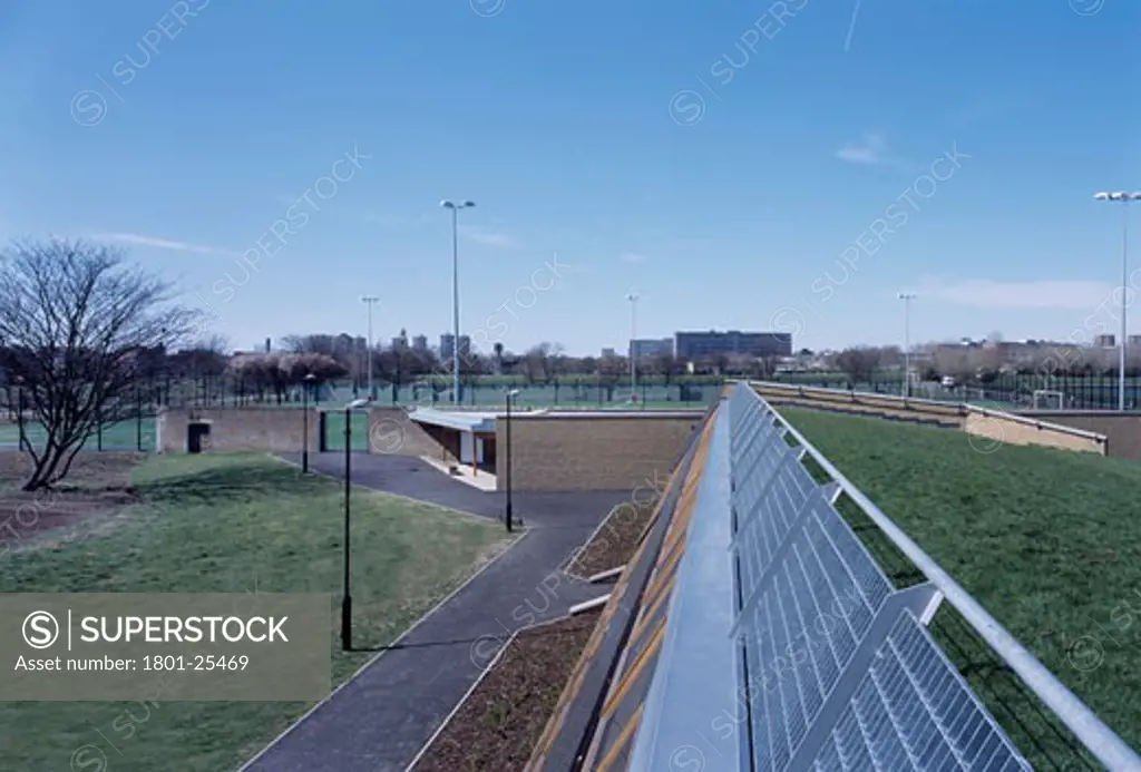BURGESS PARK FOOTBALL PAVILION, BURGESS PARK, LONDON, SE5 CAMBERWELL, UNITED KINGDOM, VIEW FROM LANDSCAPED ROOF OF CHANGING AREA BLOCK LOOKING WEST OVER THE PITCH, DAY, STUDIO E ARCHITECTS