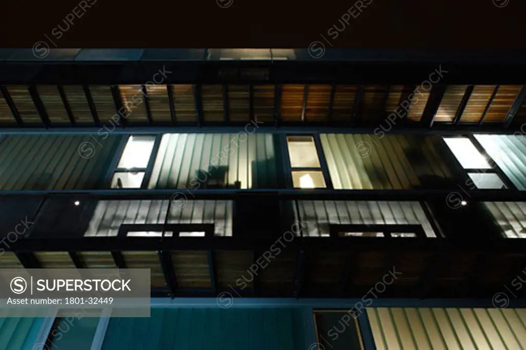 Dkh - residential development exterior dusk glass wall kitchen bedrooms balcony., Dkh - Residential Development, Dog Kennell Hill, London, SE22 East Dulwich, United Kingdom, John Smart Architects