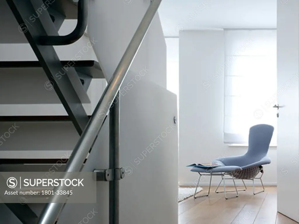 Private house daytime photograph of stair and day room beyond., Private House, London, Greater London, Thompson Baroni Architects