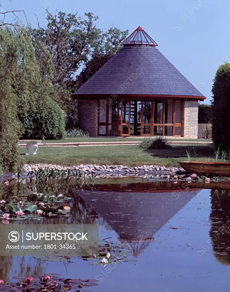 Garden Pavilion, Chichester, United Kingdom, Atelier Architecture and Design, Garden pavilion view across garden lake with waterlilies.