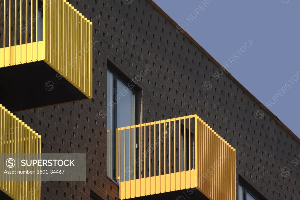 Barking Learning Centre and Apartments, London, United Kingdom, Ahmm Allford Hall Monaghan Morris Llp, Barking central apartments yellow balconies against dark brick facade.