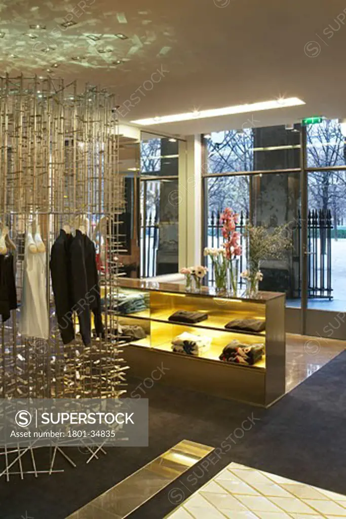 Stella McCartney Store, Paris, France, Angus Pond Architects, Stella McCartney store 'rain unit' for displaying clothes and counter.