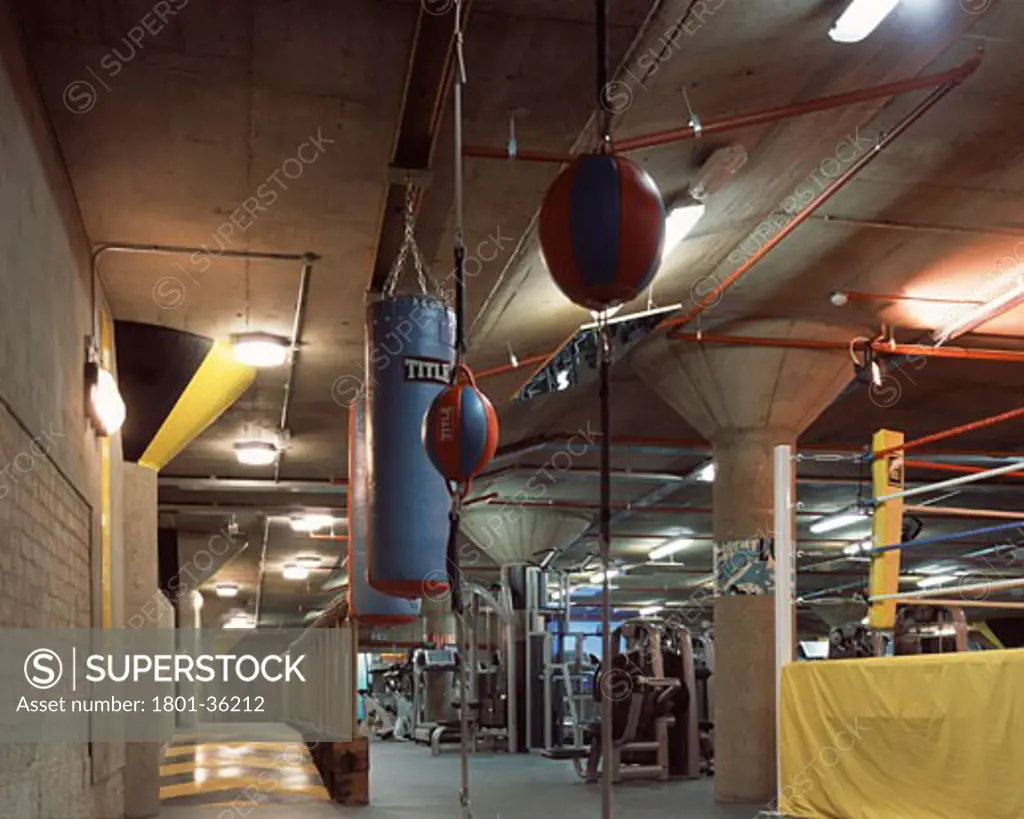 Gymbox Healthclub, London, United Kingdom, Ben Kelly Design, Gymbox healthclub view of gym floor and punchbags from boxing ring.
