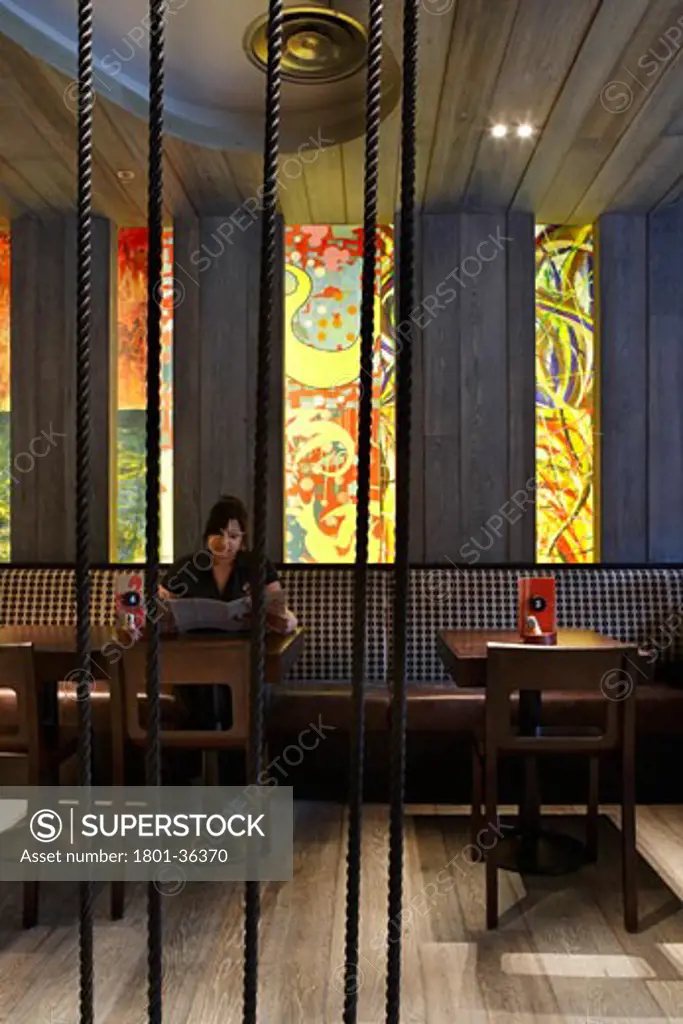 Nando's Restaurant Manchester Spinningfields, Manchester, United Kingdom, Buckley Gray Yeoman, Nando's restaurant spinningfields manchester view of seating and wall decoration.