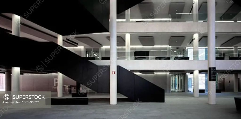 City of Justice, Barcelona, Spain, David Chipperfield, General interior view of atrium showing floor to celing perspective and colums with staircase and corridors.