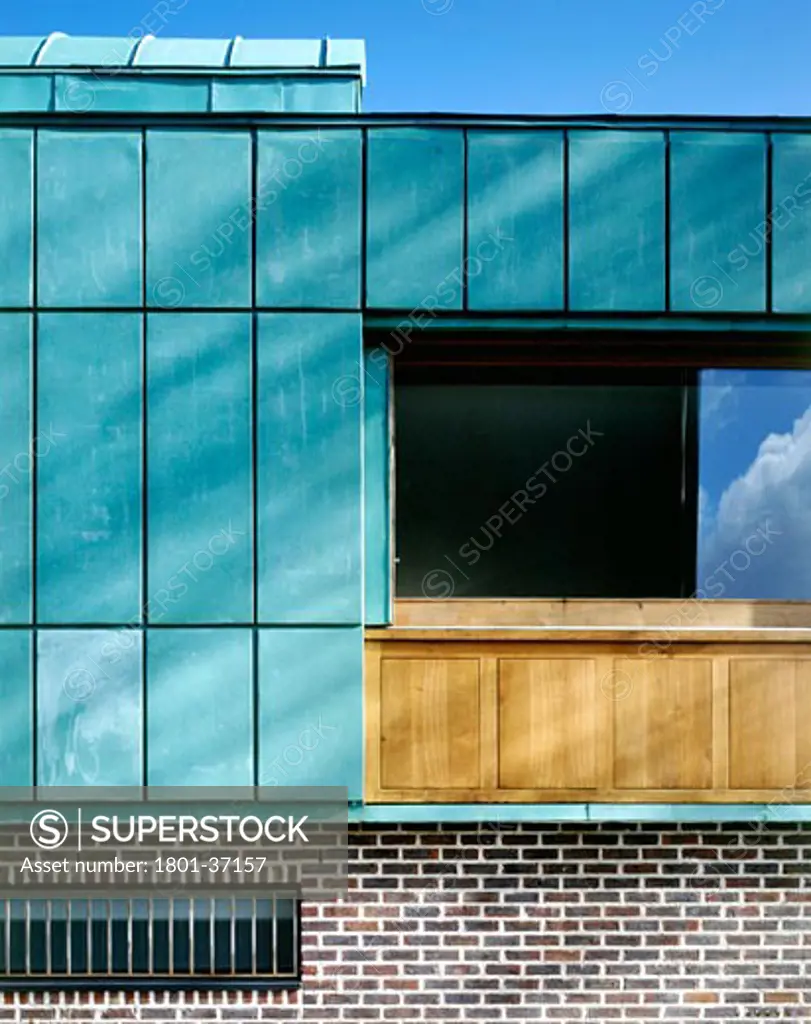 Mews Housing, Dublin, Ireland, De Blacam and Meagher, Mews housing detail of copper/window/brick work of street elevation.