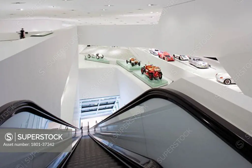 Porsche Museum, Stuttgart, Germany, Delugan Meissl Associated Architects, Porsche museum: general view down the esculator from the top gallery floor..