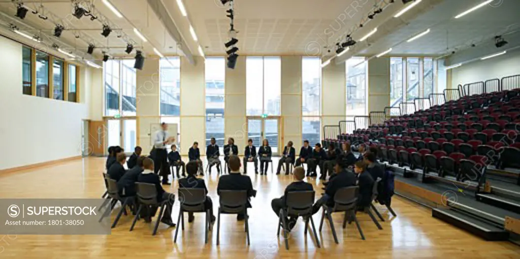 St Mary Magdalene Academy, London, United Kingdom, Feilden Clegg Bradley Architects, St mary magdalene academy hall with tiered seating and circle of pupils.