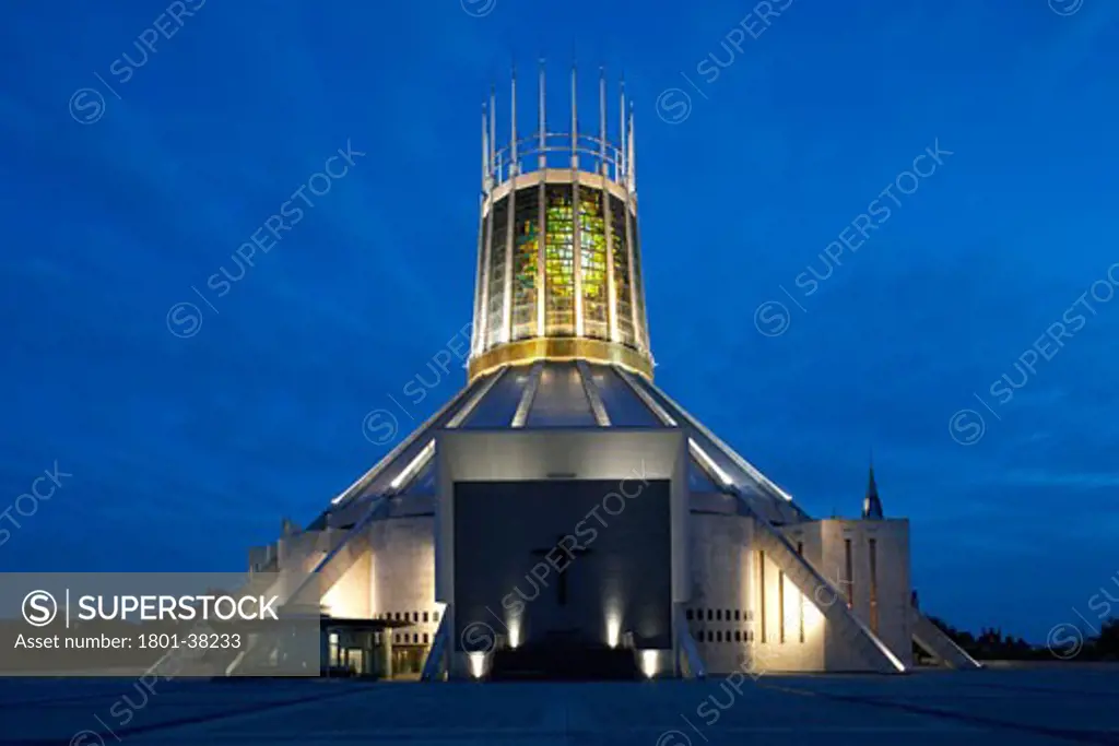 Metropolitan Catholic Cathedral, Liverpool, United Kingdom, Frederick Gibberd Partnership, Metropolitan catholic cathedral liverpool exterior shot showing the main entrance illuminated by night.