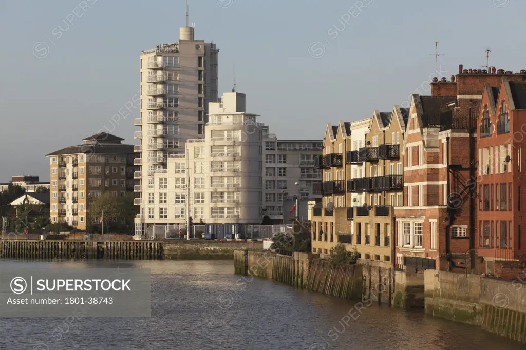 Pierhead Lock, London, United Kingdom, Goddard Manton Ltd, Pierhead lock with river thames and traditional isle of dogs riverside houses in early morning light.