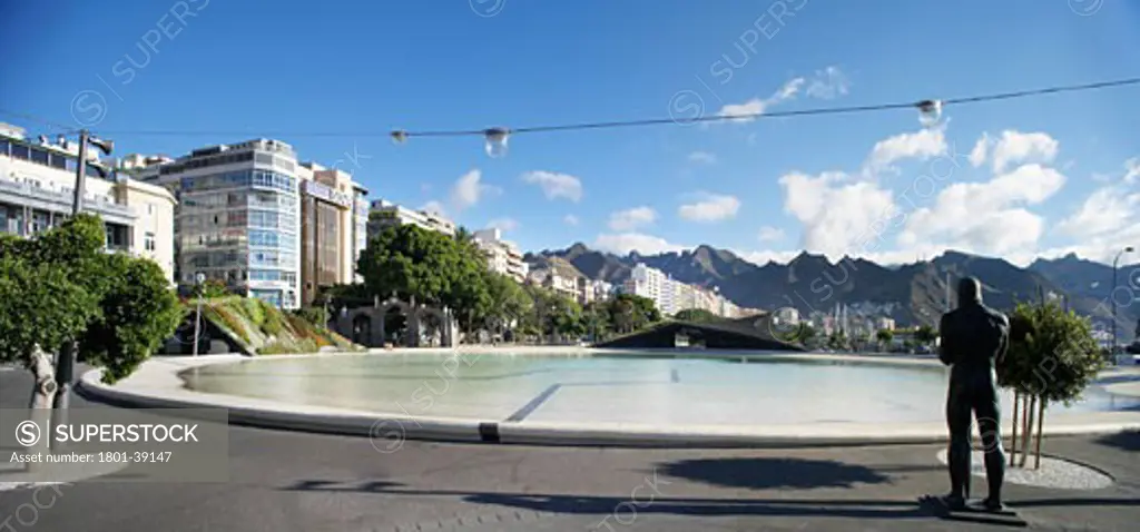 Plaza De Espana, Santa Cruz De Tenerife, Spain, Herzog & De Meuron, Plaza de espana general view of the plaza and the wading pool showing a statue of a male figure.