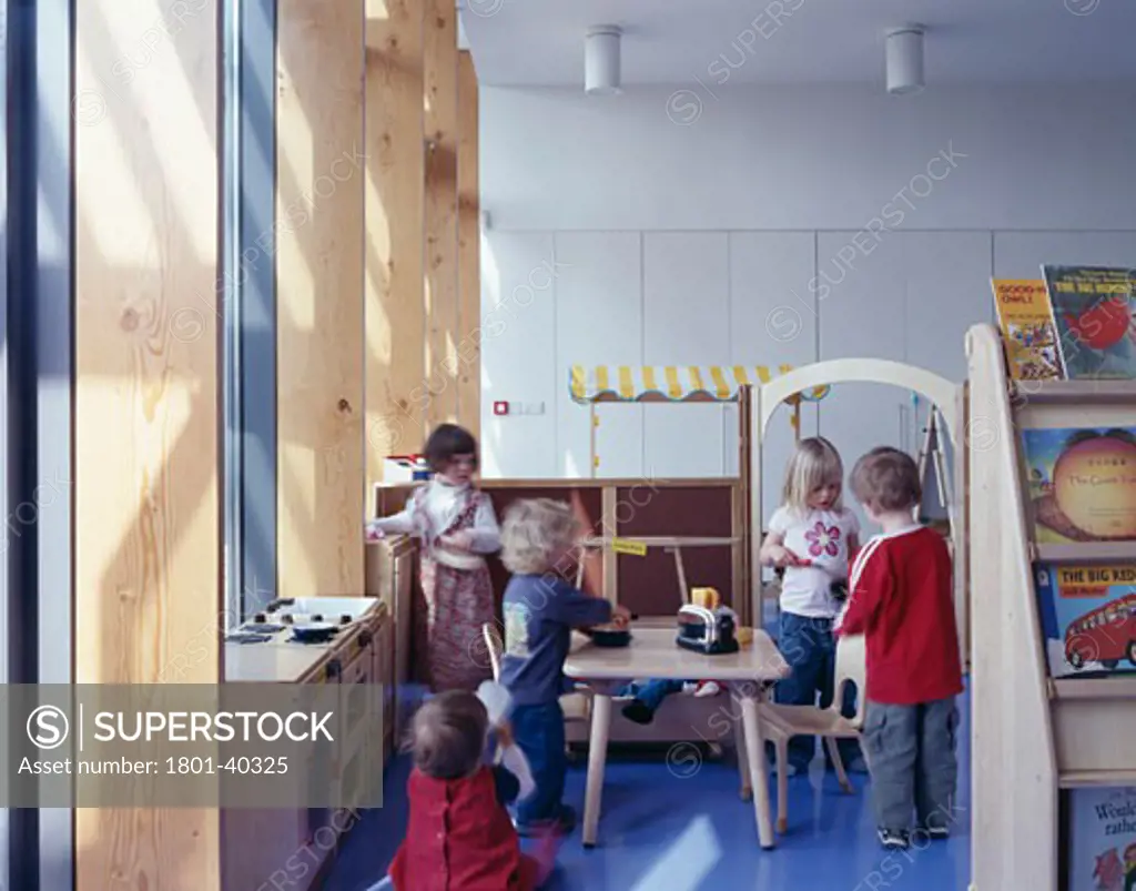 Surestart School, London, United Kingdom, John McAslan and Partners, Surestart school classroom with children near window light.