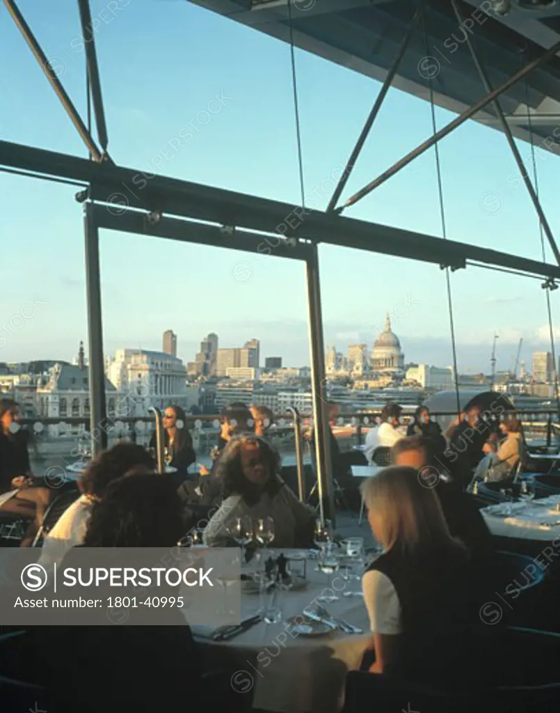 Oxo Tower Restaurant Bar and Brasserie, London, United Kingdom, Lifschutz Davidson Sandilands, Oxo tower restaurant bar and brasserie sectional view of restaurant at sunset looking out over the terrace to the city of london.
