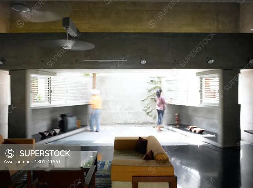 Residence for Ashok Patel, Ahmedabad, India, Matharoo Associates, Patel house one ton concrete wall opening to side courtyard.
