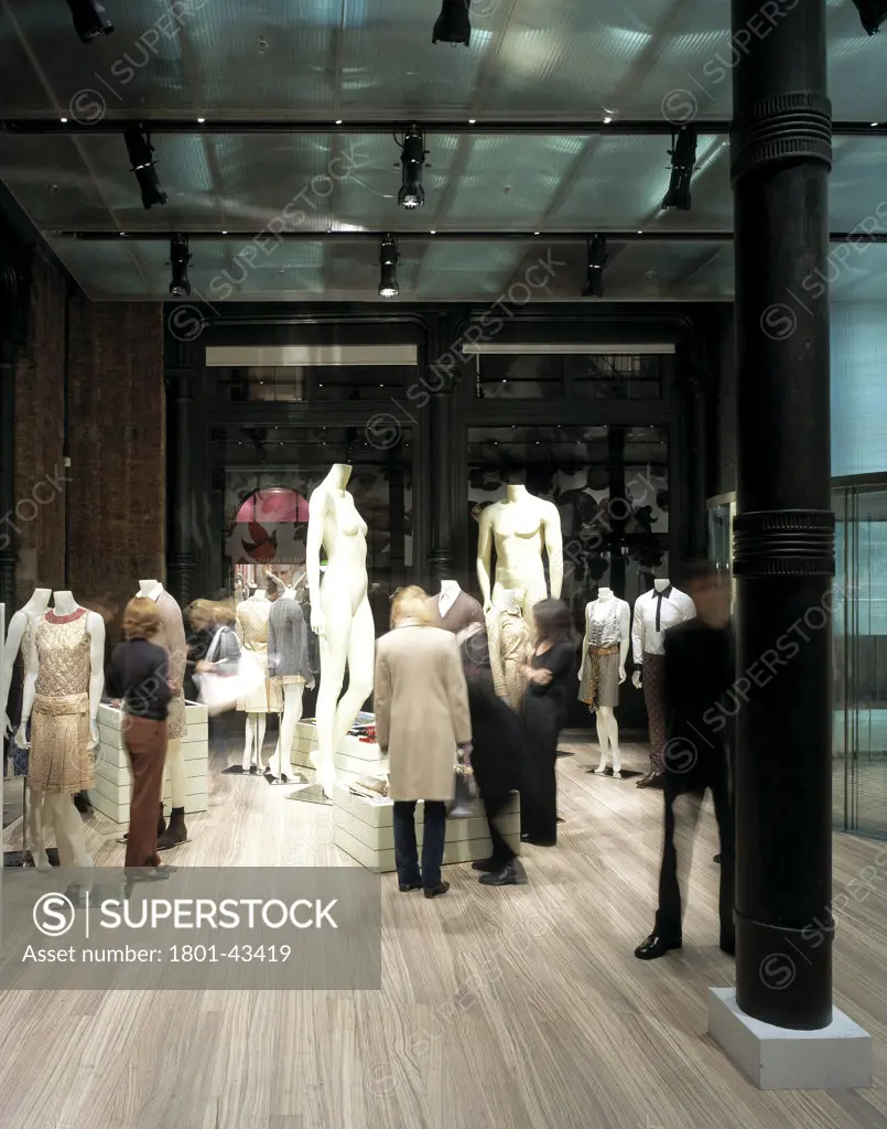 Prada Fashion Store, New York, United States, Rem Koolhaas - Office for Metropolitan Architecture, Prada fashion store portrait view of column and mannequins.