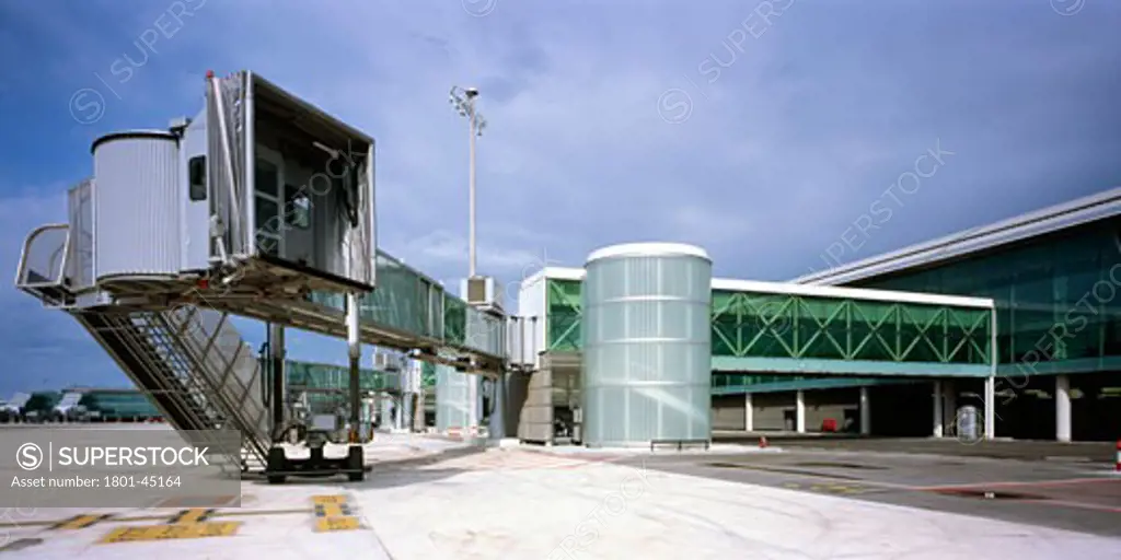 T1 Barcelona New Aiport Terminal, Barcelona, Spain, Ricardo Bofill-Taller De Arquitectura, Exterior view of terminal finger as seen from the outside of the terminal building from the carriage road system that interconnects the different areas of the airport.