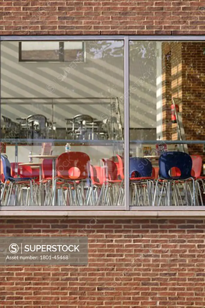 Broadway Theatre Barking, London, United Kingdom, Tim Foster Architects, Broadway theatre barking cafe with red and blue tables and chairs in dappled sunlight.