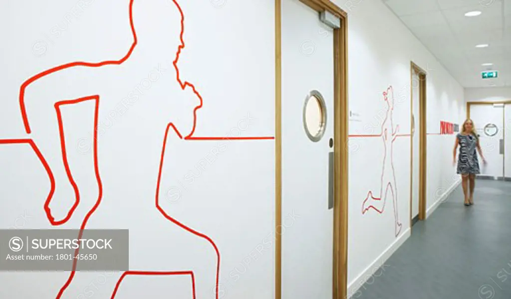 Johnson & Johnson Medical Ltd, Wokingham, United Kingdom, Tp Bennett, Johnson & johnson medical ltd wokingham interior view of a woman walking along a corridor with feature wall murals.