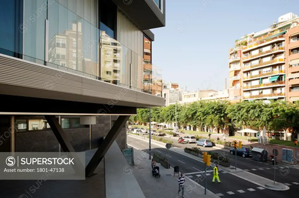 Just Style More Than Apartments, Barcelona, Spain, Archikubik, DETAIL SHOWING FIRST FLOOR COMMUNAL TERRACE AND CONCRETE STRUCTURAL PILLAR LOOKING TOWARS THE MAIN STREET
