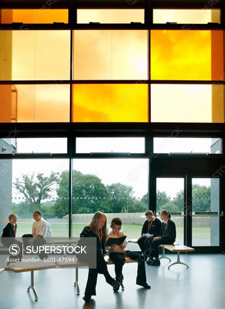 Brislington Enterprise College, Bristol, United Kingdom, Flacq Architects, BRISLINGTON ENTERPRISE COLLEGE FLACQ ARCHITECTS BRISTOL 2008. AN INTERIOR SHOT SHOWING STUDENTS AND TEACHERS SEATED IN THE SPACIOUS LOBBY AREA