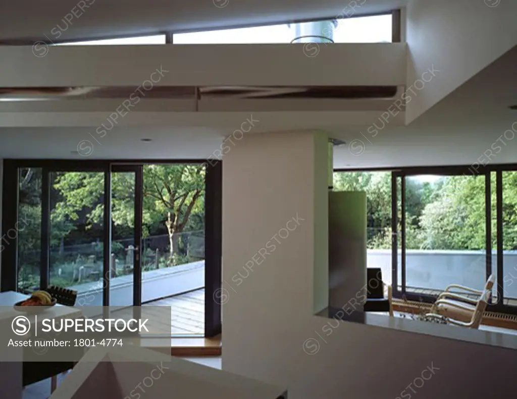 PRIVATE HOUSE, LONDON, N6 HIGHGATE, UNITED KINGDOM, VIEW PASSED CHAIR TO FIRE AND STAIR, BERE ARCHITECTS