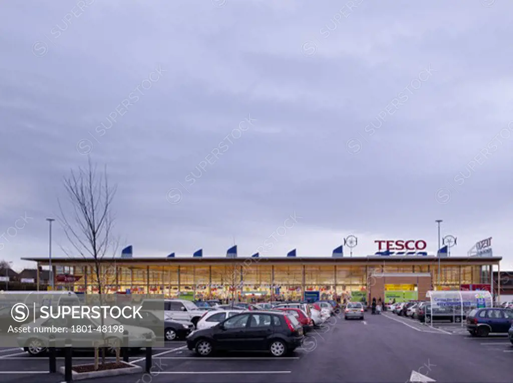 Tesco Cheetham Hill, Manchester, United Kingdom, Michael Aukett Architects, TESCO CHEETHAM HILL MANCHESTER MICHAEL AUKETT ARCHITECTS 2009 ENERGY EFFICIENCY LONG SHOT OF MAIN ENTRANCE ELEVATION WITH PARKING