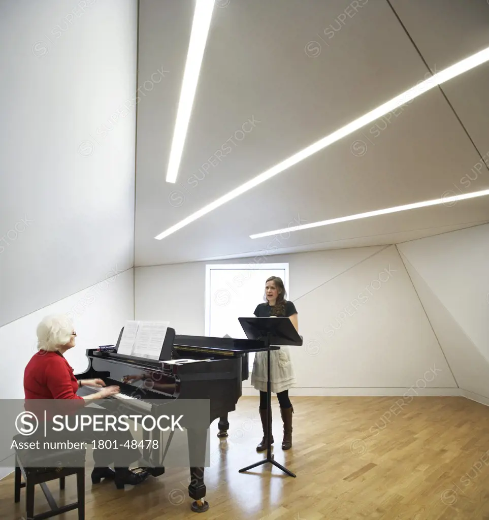 Royal Academy of Music, London, United Kingdom, John McAslan and Partners, ROYAL ACADEMY OF MUSIC JOHN MCASLAN & PARTNERS 2002. INTERIOR SHOT OF A SPACIOUS PRACTICE ROOM SHOWING A PIANIST AND SINGER REHEARSING
