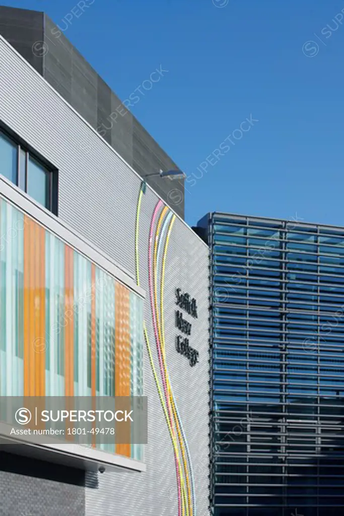 Suffolk New College Ipswich, Ipswich, United Kingdom, Sheppard Robson, SUFFOLK NEW COLLEGE SHEPPARD ROBSON IPSWICH SUFFOLK UK 2009. EXTERIOR SHOT SHOWING THE COLOURFUL GLASS PANELS AND BUILDING NAME SIGNAGE AGAINST THE CLEAR BLUE SKY