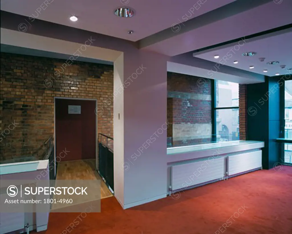 WATFORD PALACE THEATRE, CLARENDON ROAD, WATFORD, HERTFORDSHIRE, UNITED KINGDOM, FIRST FLOOR BAR AREA - LOOKING TOWARDS EXPOSED BRICKWALL WITH CUBE’ SEATING IN FOREGROUND, BURRELL FOLEY FISCHER